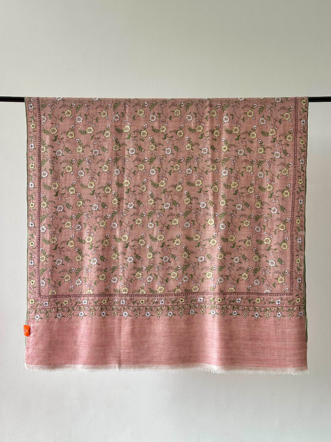Pink floral patterned fabric on a white background